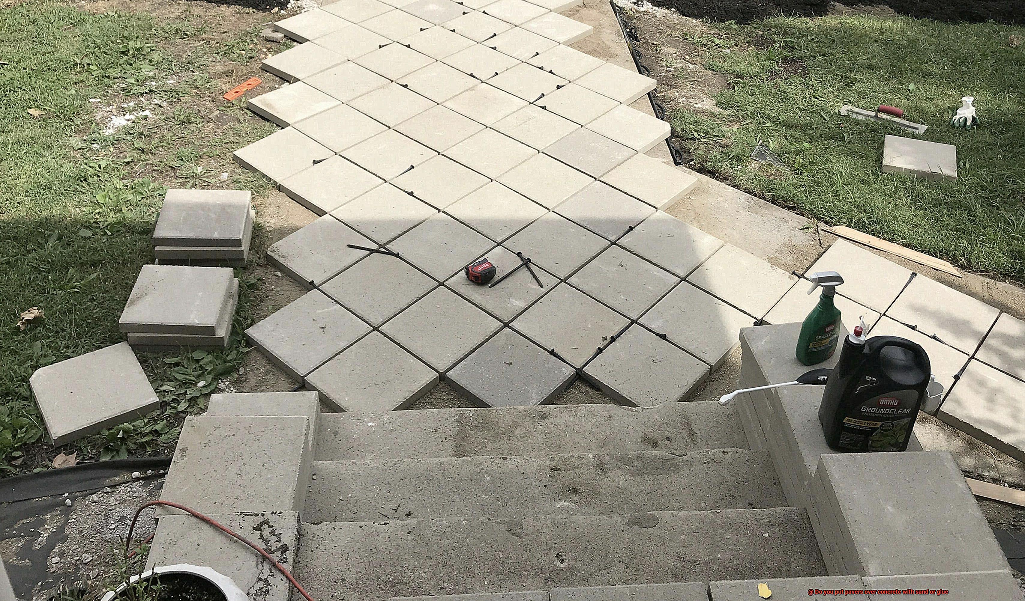 Do you put pavers over concrete with sand or glue-11