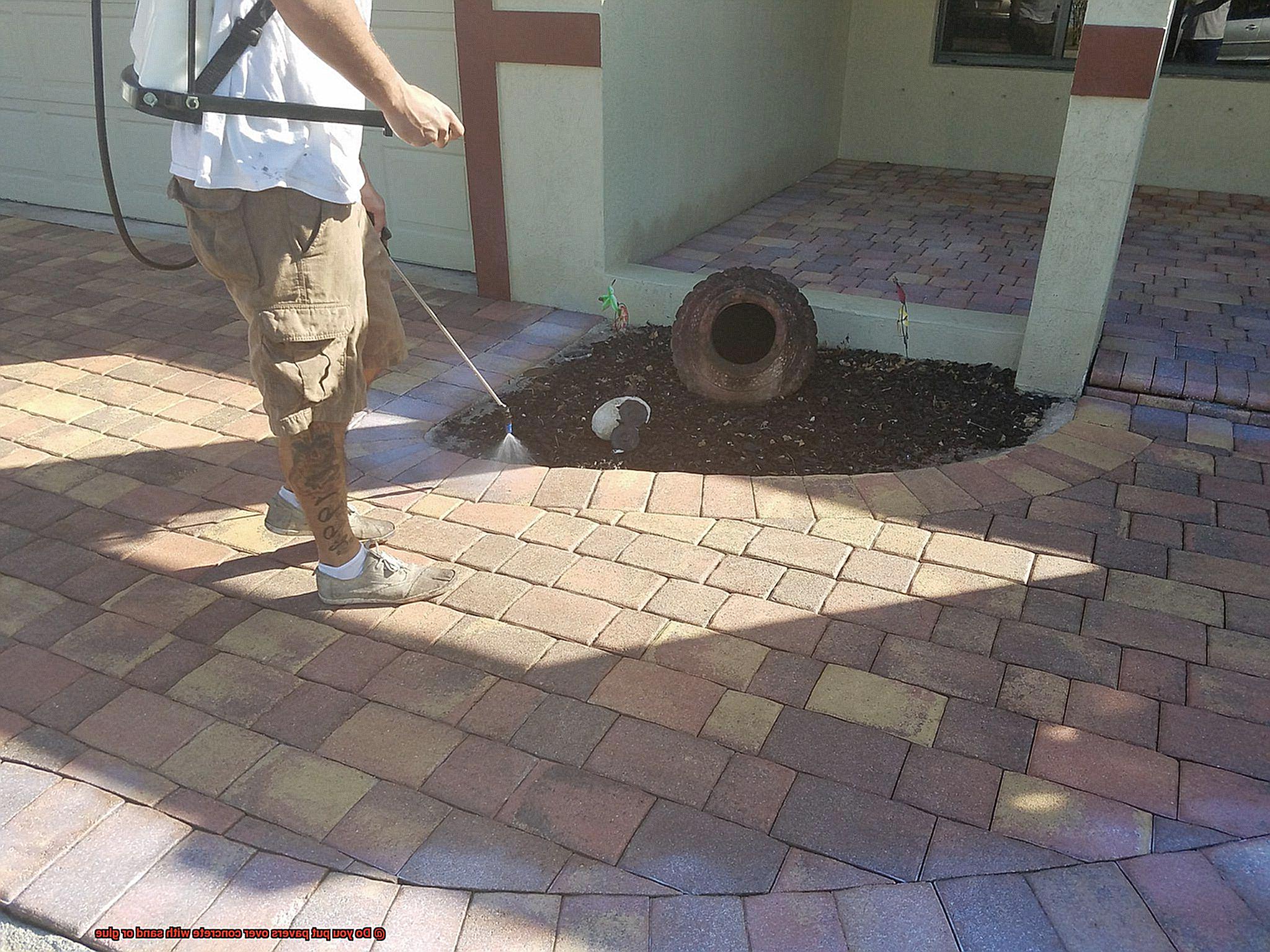 Do you put pavers over concrete with sand or glue-2