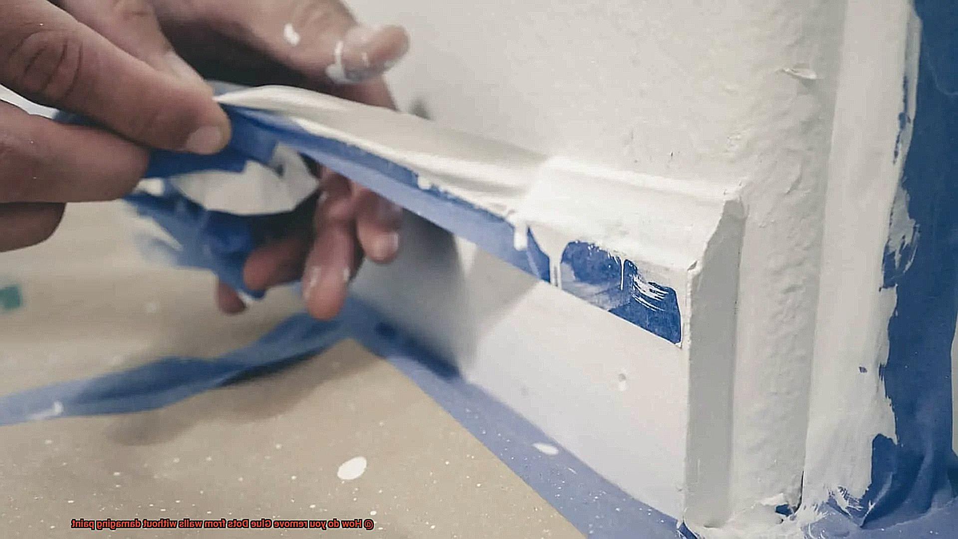 How do you remove Glue Dots from walls without damaging paint-3