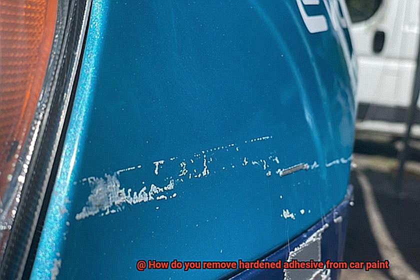 How do you remove hardened adhesive from car paint-2