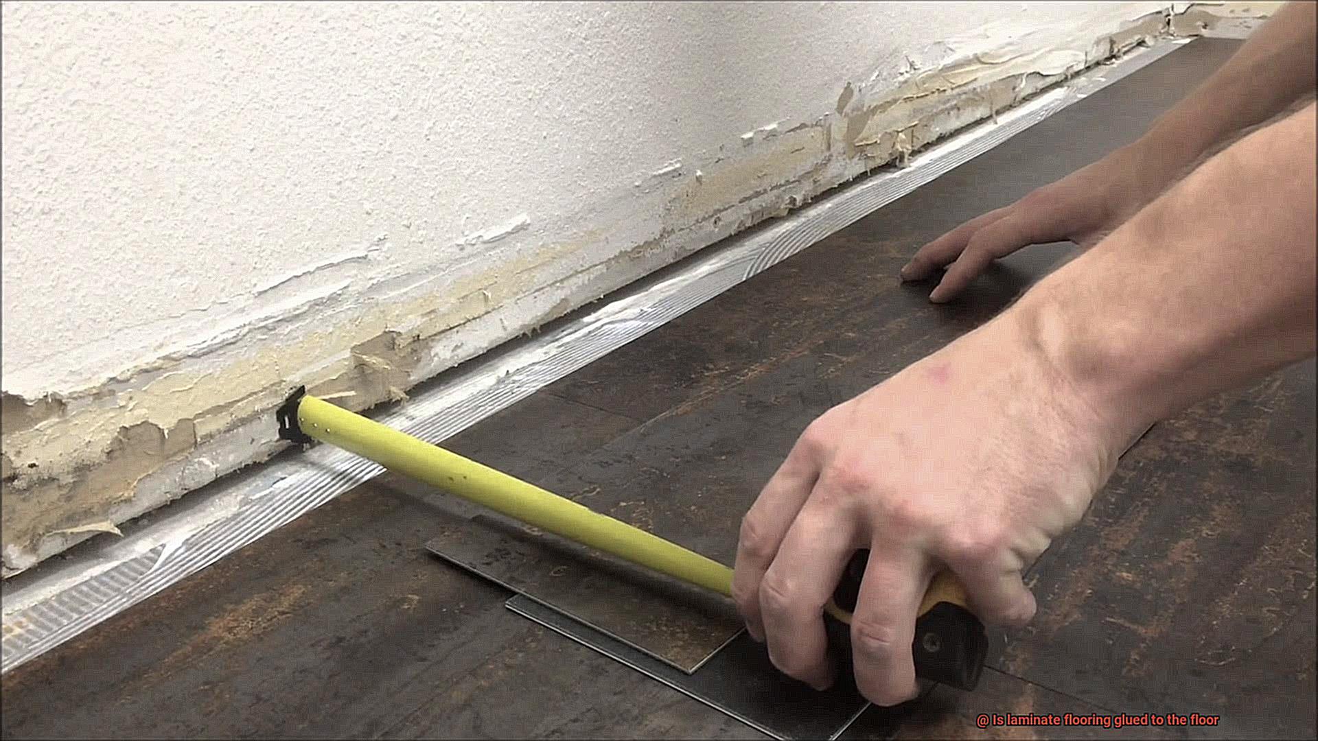 Is laminate flooring glued to the floor-2